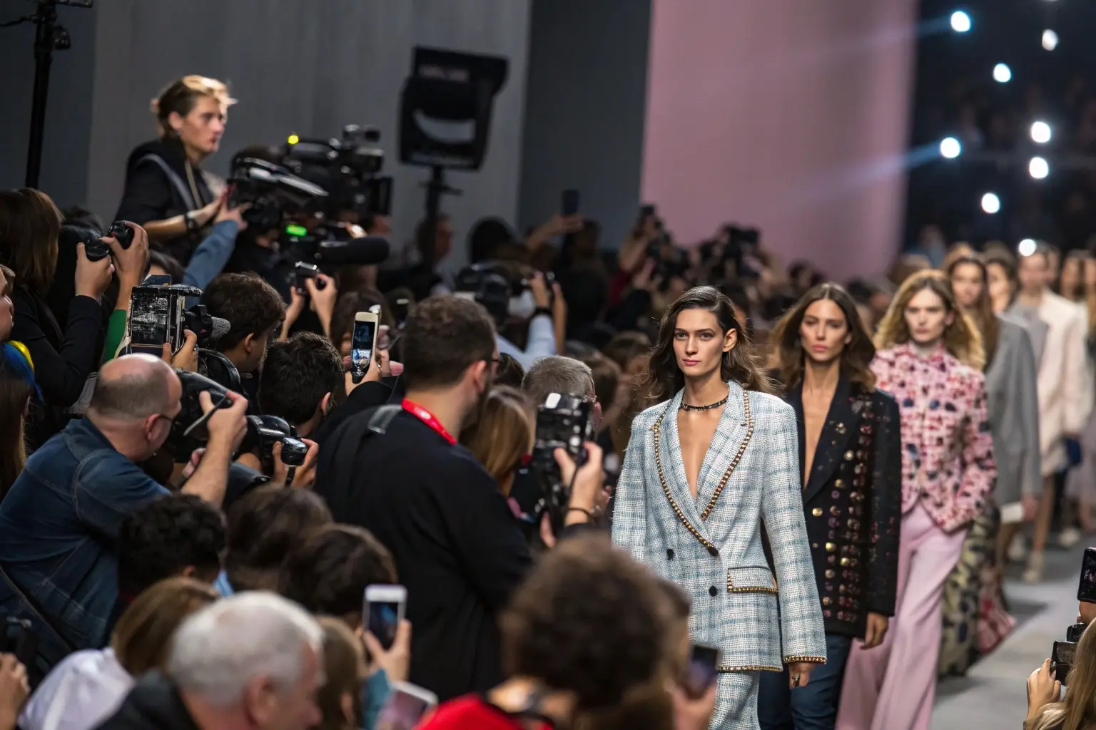 Fashion models walking the runway at a high-end fashion show