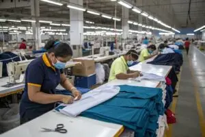 a-factory-floor-with-workers-performing-essential