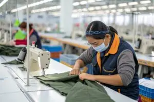 a-factory-worker-assembling-a-garment--stitching-