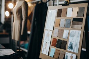 Fashion mood board with fabric samples and clothing sketches