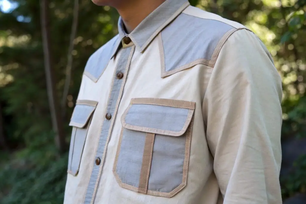 Close-up of a stylish two-tone button-up shirt