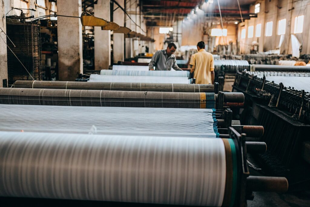 Large textile production factory with industrial fabric weaving machines