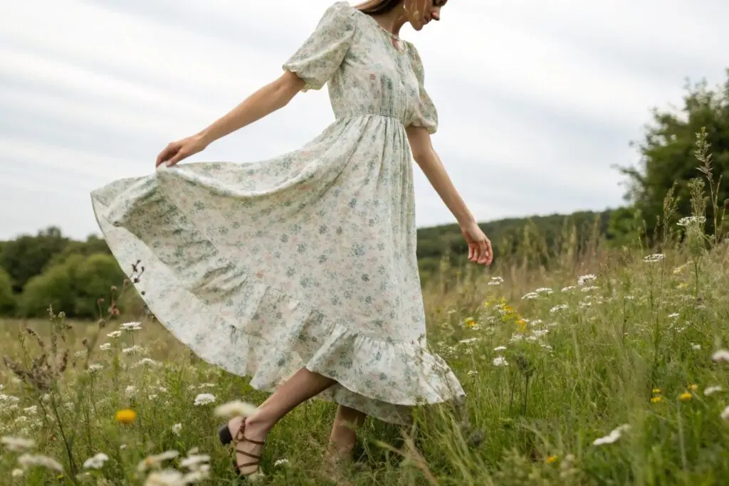 Women's floral midi dress with puff sleeves and ruffled hem, perfect for spring
