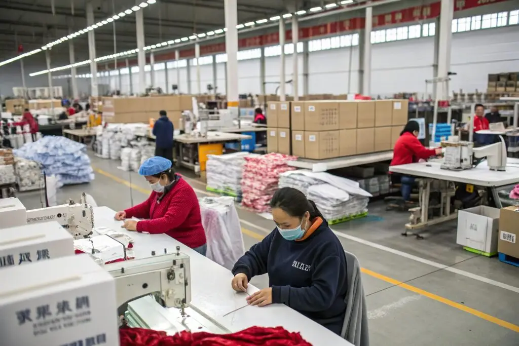 Workers sewing garments in a clothing factory