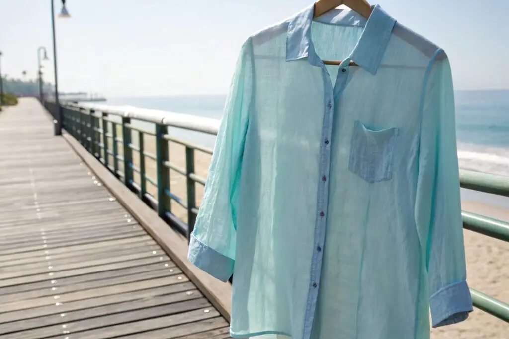 Lightweight sheer beach cover-up shirt in pastel blue, perfect for summer