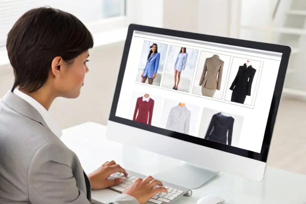 Business owner browsing through clothing options on computer