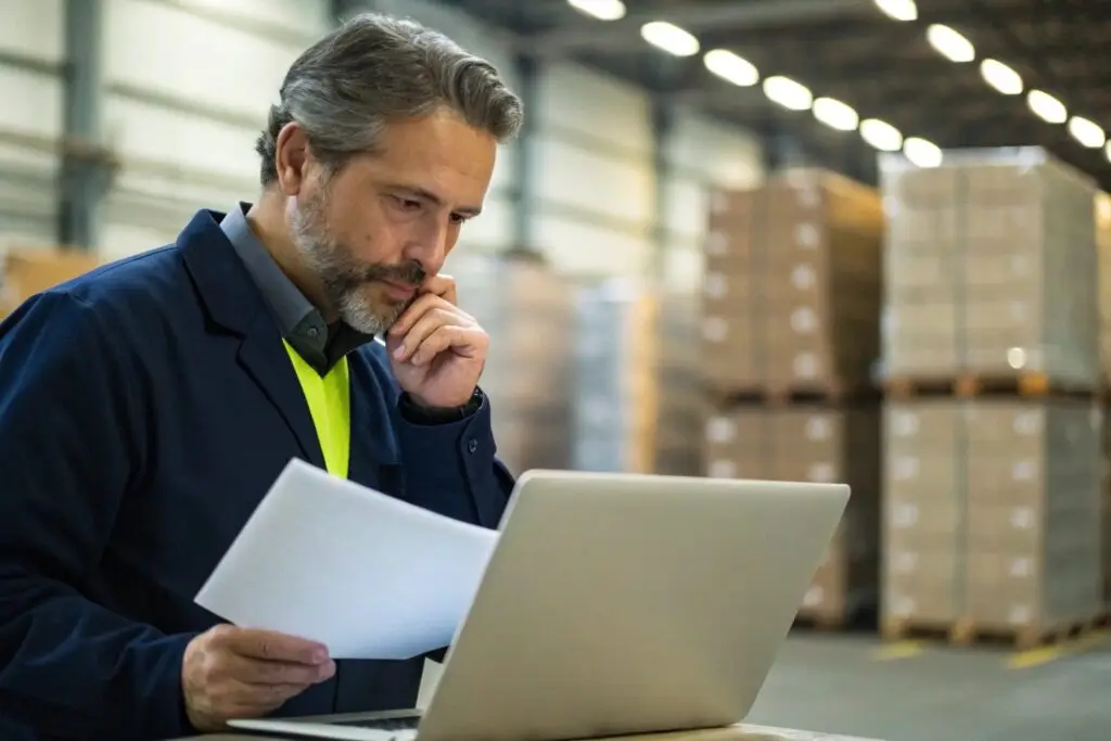 Business owner reviewing certifications