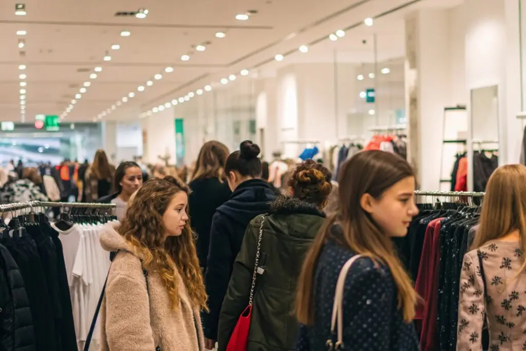 Shoppers browsing clothes in store