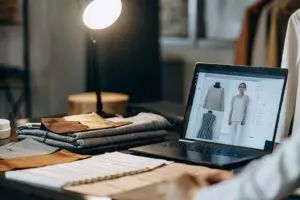 Fashion design and digital clothing customization process on a laptop