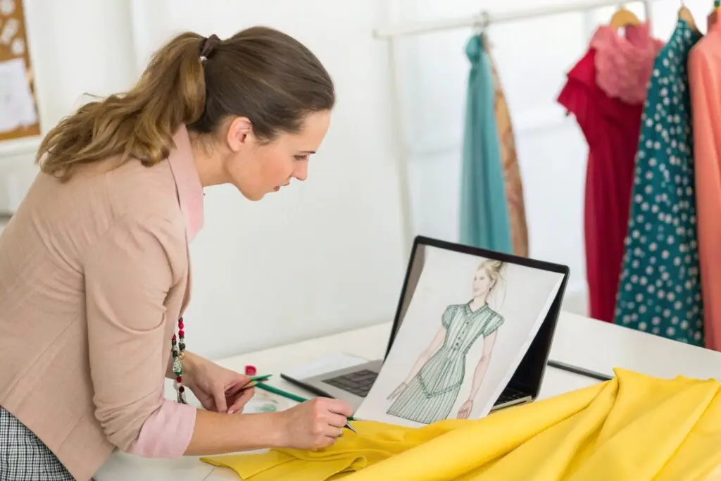 Fashion designer reviewing a dress sketch