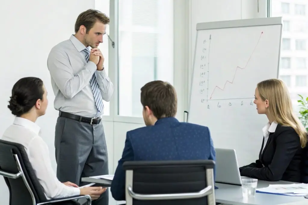 Business owner discussing sales growth in a meeting