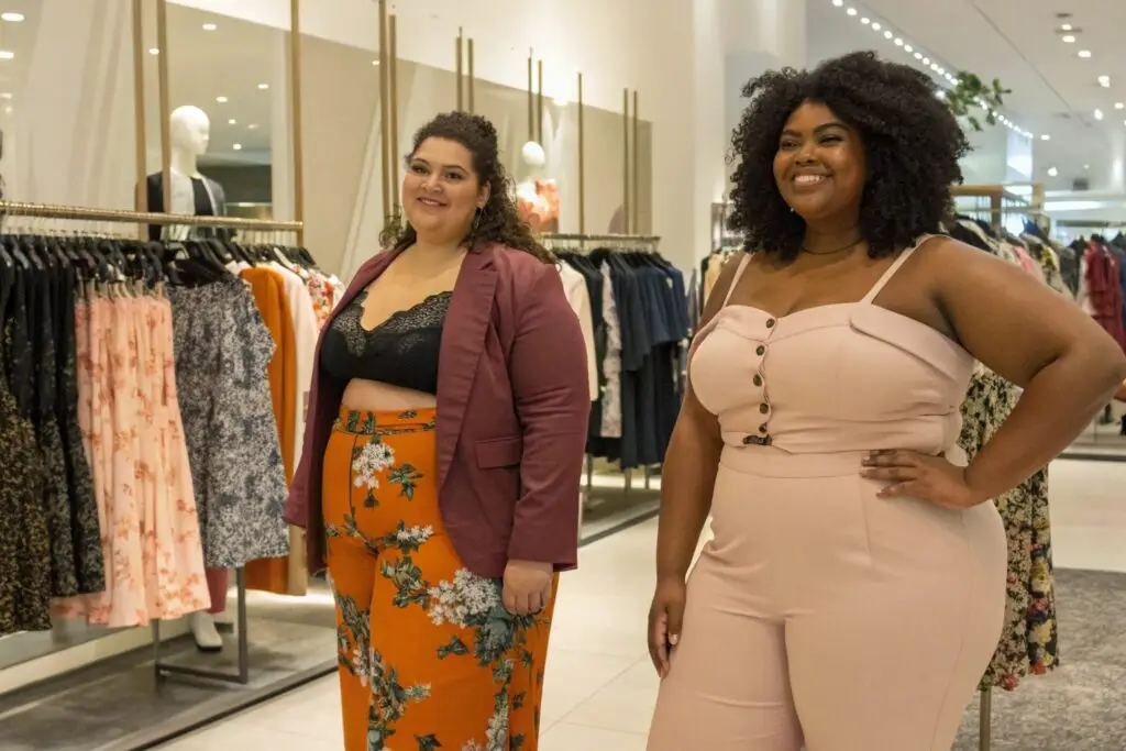 Plus-size fashion models showcasing trendy outfits in a boutique setting