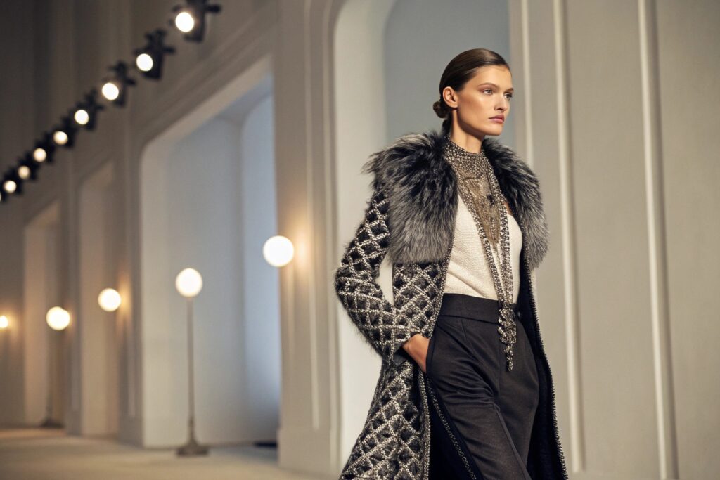 Model showcasing elegant fashion in runway