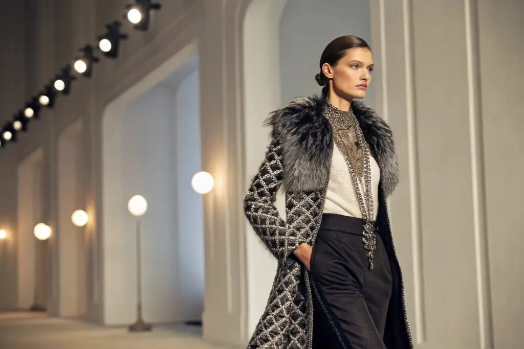 Model showcasing elegant fashion in runway