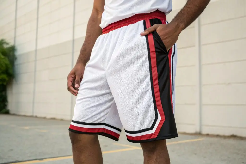 Men's white basketball shorts with red and black stripes, breathable and sporty