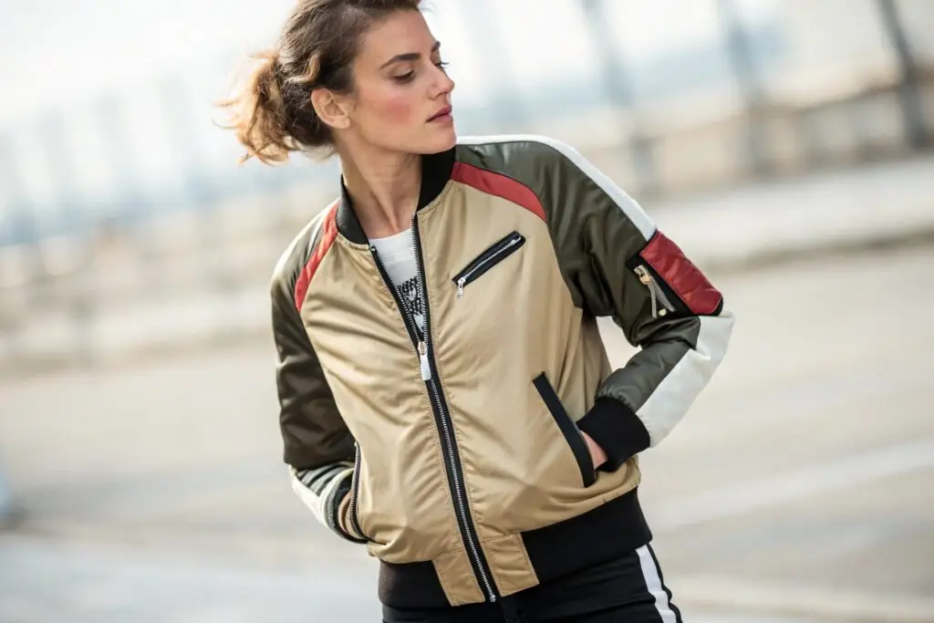 Trendy women's bomber jacket with multicolor design and zip pockets
