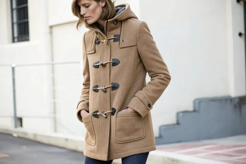 Women's camel-colored duffle coat with hood and toggle closures