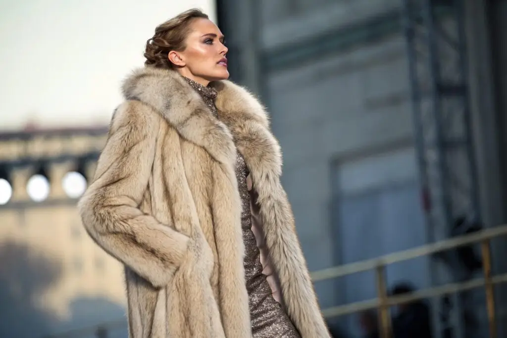 Luxurious women's faux fur coat in elegant beige color