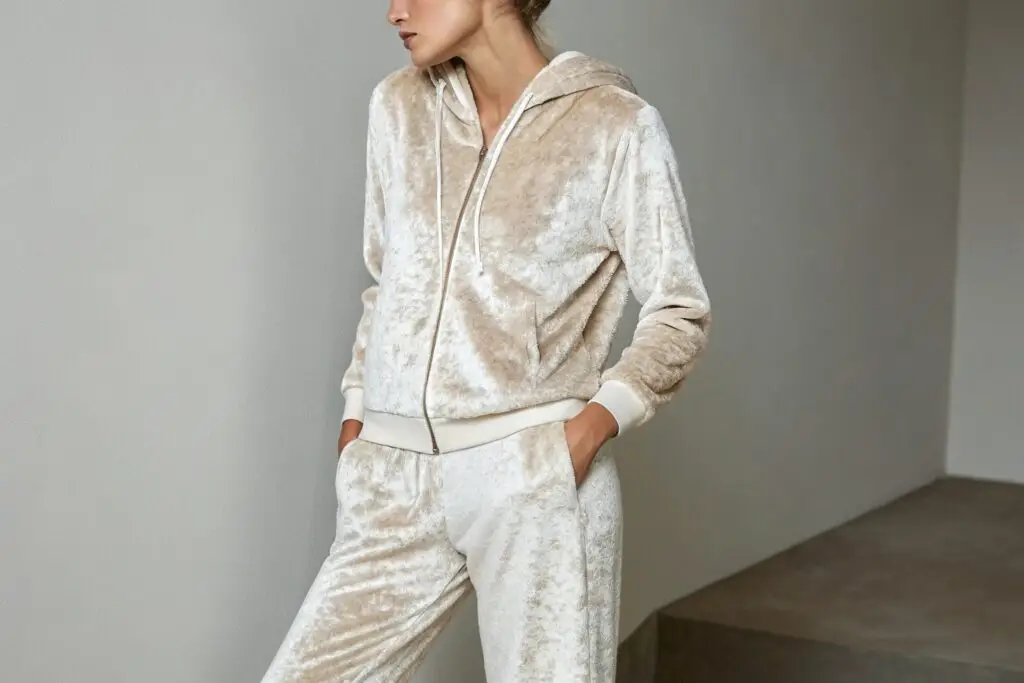 Model in a beige velour tracksuit