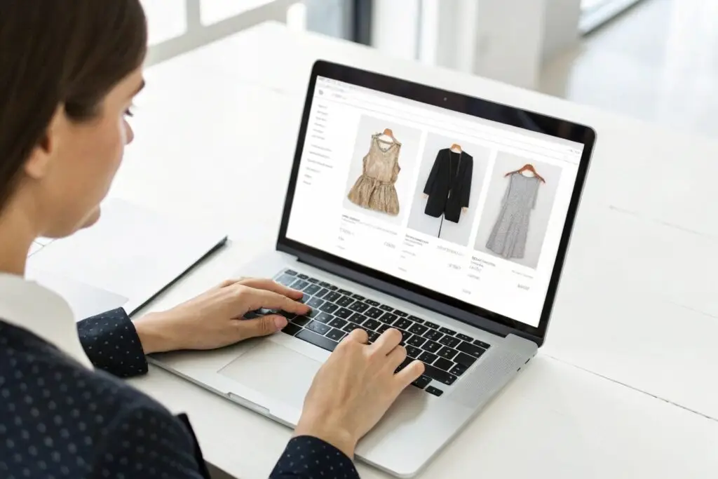 Fashion buyer viewing clothing options on wholesale site