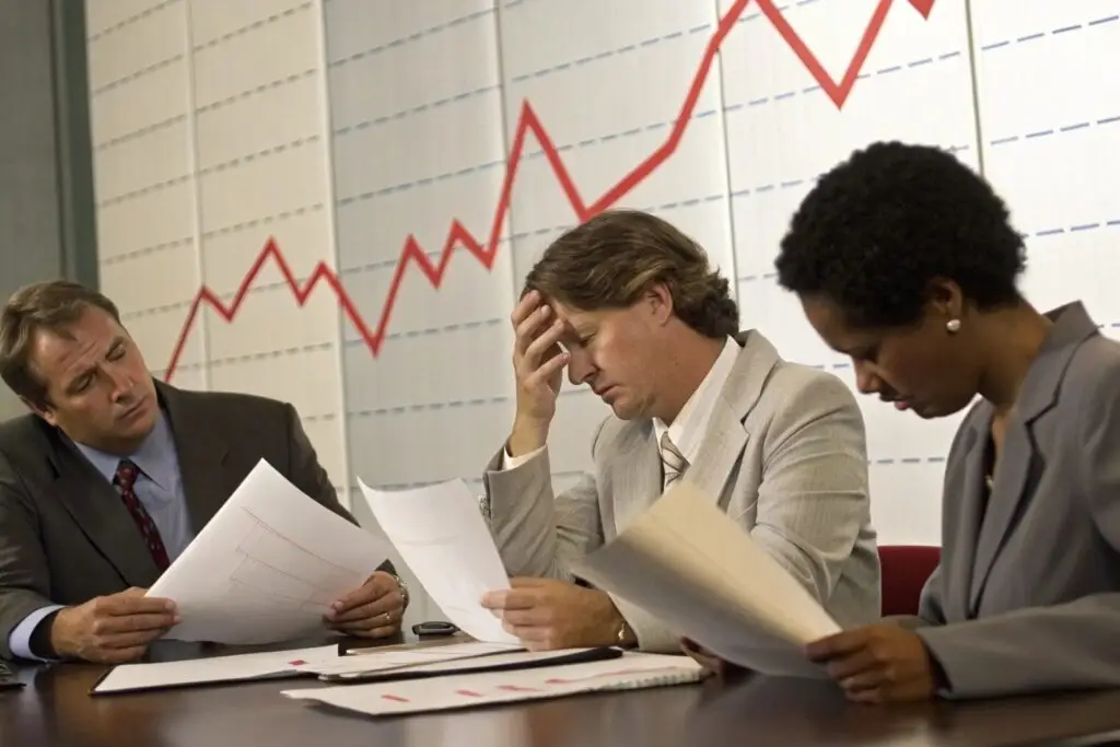 Boardroom with American apparel executives discussing performance