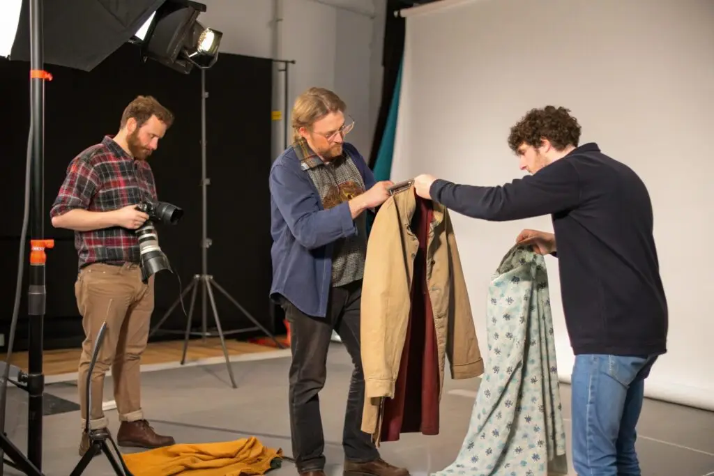 Fashion team preparing garments for product photography
