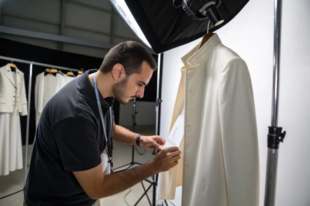 Quality control expert inspecting elegant white garment