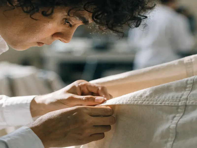 Quality inspector examining garment